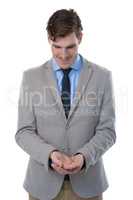 Businessman pretending to hold an invisible object