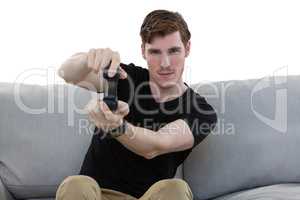 Man playing video game against white background