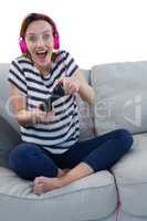 Woman in headphones playing video game