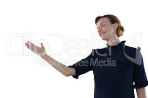 Female executive gesturing against white background