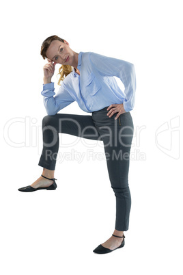 Female executive posing against white background