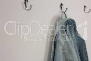 Denim jacket hanging on hook