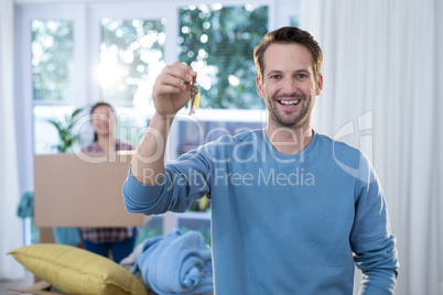 Man showing a key of their new house