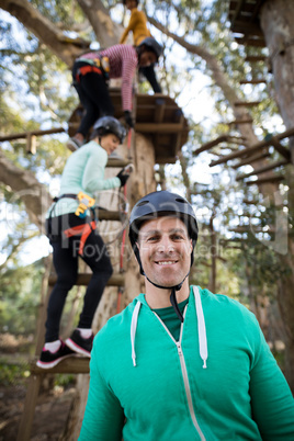 Smiling man standing in park on a sunny day