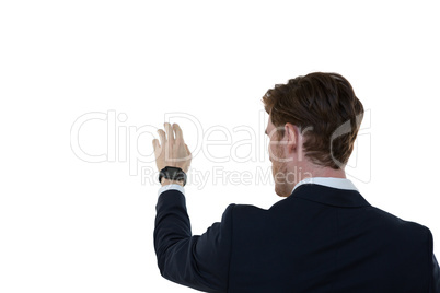 Businessman pretending to use an invisible screen