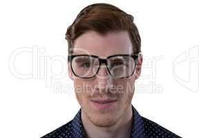 Male executive standing against white background