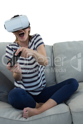 Woman playing video game with virtual reality headset