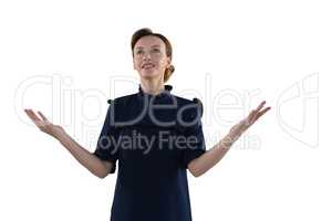 Female executive gesturing against white background