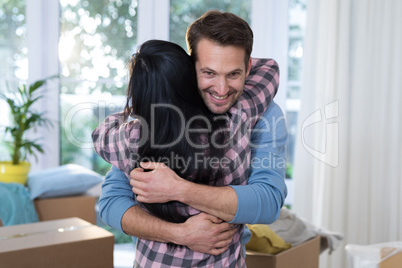 Couple embracing each other at new home