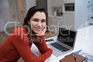 Confident woman working at desk
