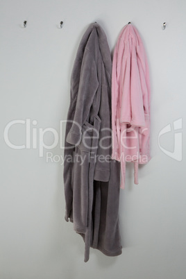 Bathrobes hanging on hook