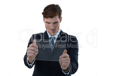 Businessman using glass digital tablet