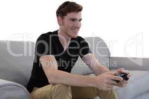 Man playing video game against white background