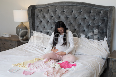 Woman feeling the presence of baby in stomach