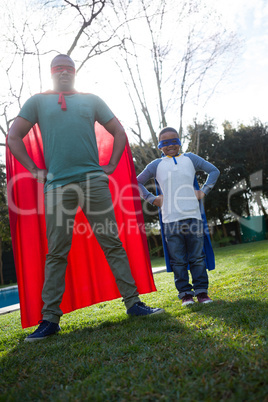 Son and father pretending to be a superhero