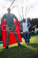 Son and father pretending to be a superhero