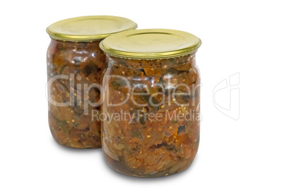 Canned eggplant in glass jar on white background.