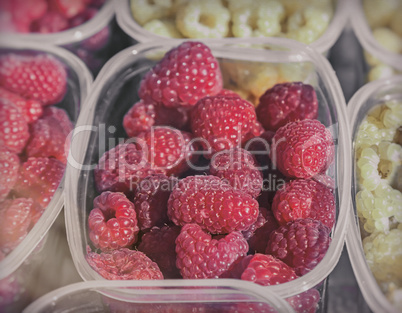 Raspberries in containers for sale.