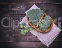 fresh cabbage broccoli in a brown wicker basket