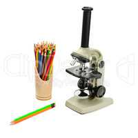 laboratory microscope and pencils isolated on white background