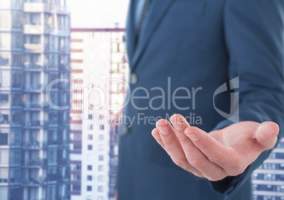 Businessman with hand palm open in city office