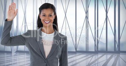 Businesswoman raising hand swearing honesty in city office