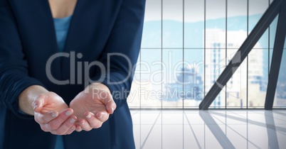 Businesswoman with hand palm open in city office