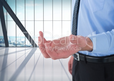 Businessman with hand palm open in city office