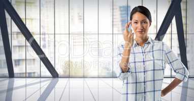 Businesswoman crossing fingers in city office