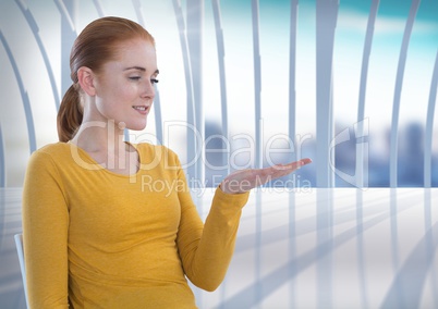 Businesswoman with hands palm open in city office