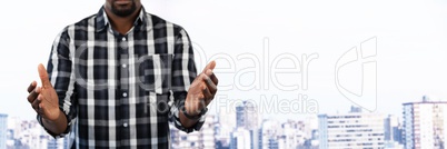 Businessman with hands palm open in city