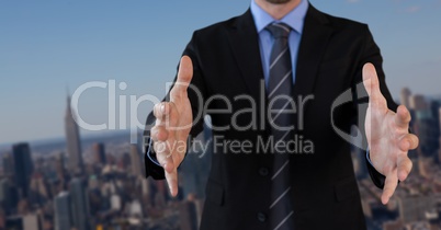 Businessman with hands palm open in city