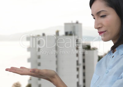 Businesswoman with hand palm open in city