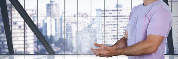 Man with hands palm open in city office