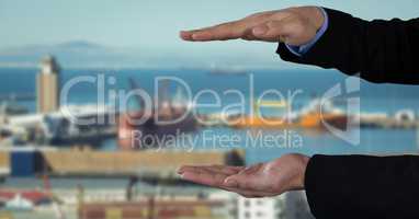 Businessman with hands palm open in city port harbor