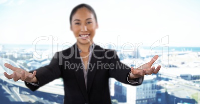 Businesswoman with hands palm open in city