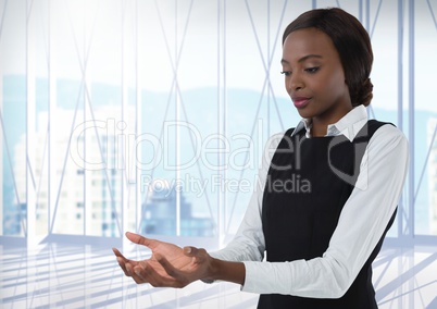 Businesswoman with hands palm open in city office