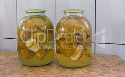 Canned pear in glass jar.