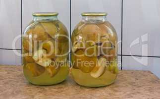 Canned pear in glass jar.