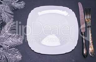 white square ceramic plate with cutlery