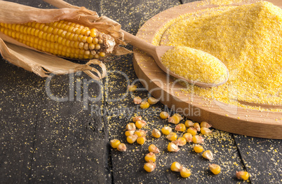 Corn cob and flour spread on table