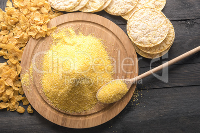 Corn products and flour on black table