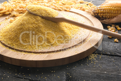 Pile of corn flour on a wooden board