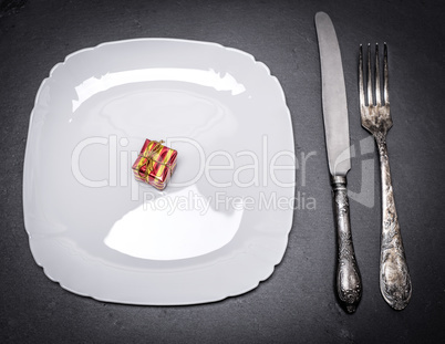 white square plate and iron cutlery