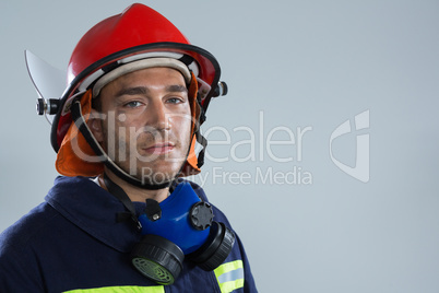 Fireman looking at camera against white background