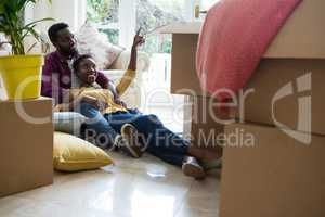 Couple relaxing in new house