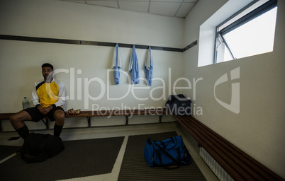 Player relaxing in changing room