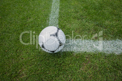 Soccer ball on white marking line