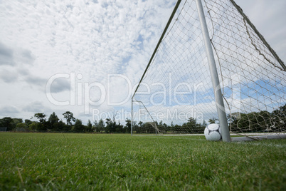 Soccer ball near a goal post