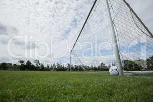 Soccer ball near a goal post